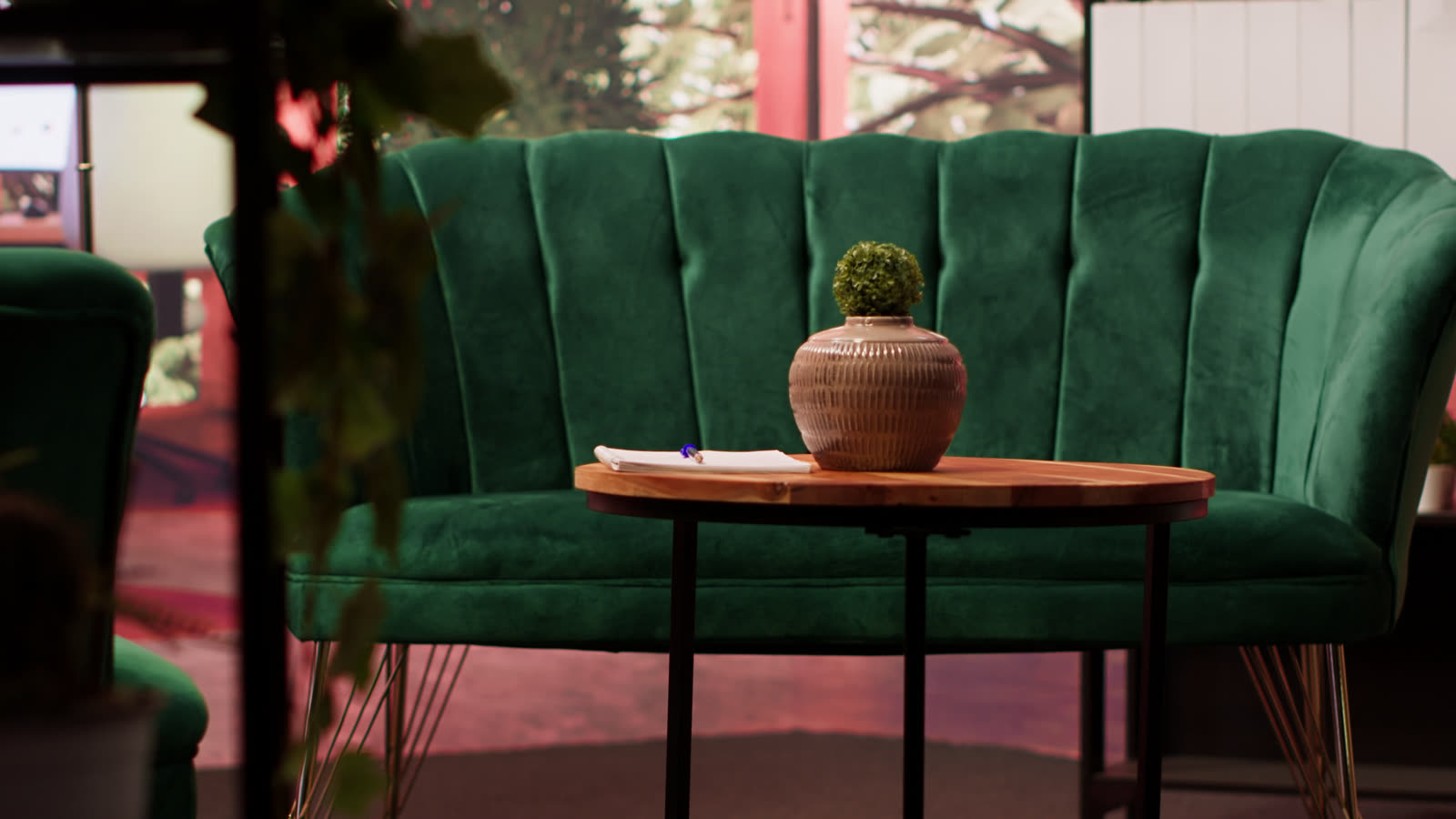 An empty psychotherapy office with chairs and plants